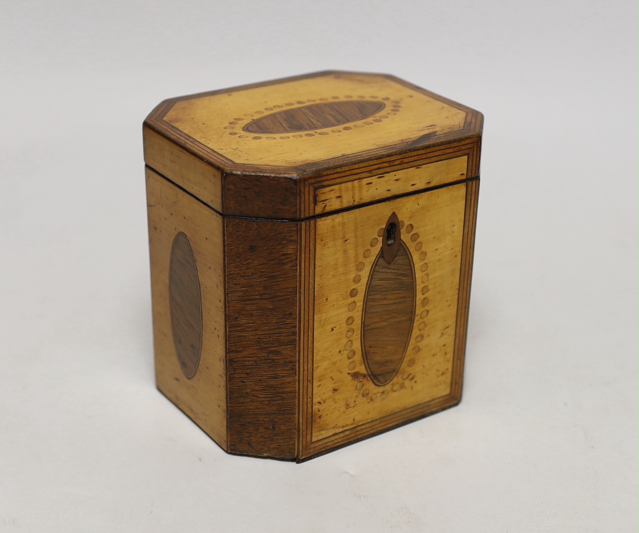 A George III sycamore and rosewood octagonal tea caddy, 13cm